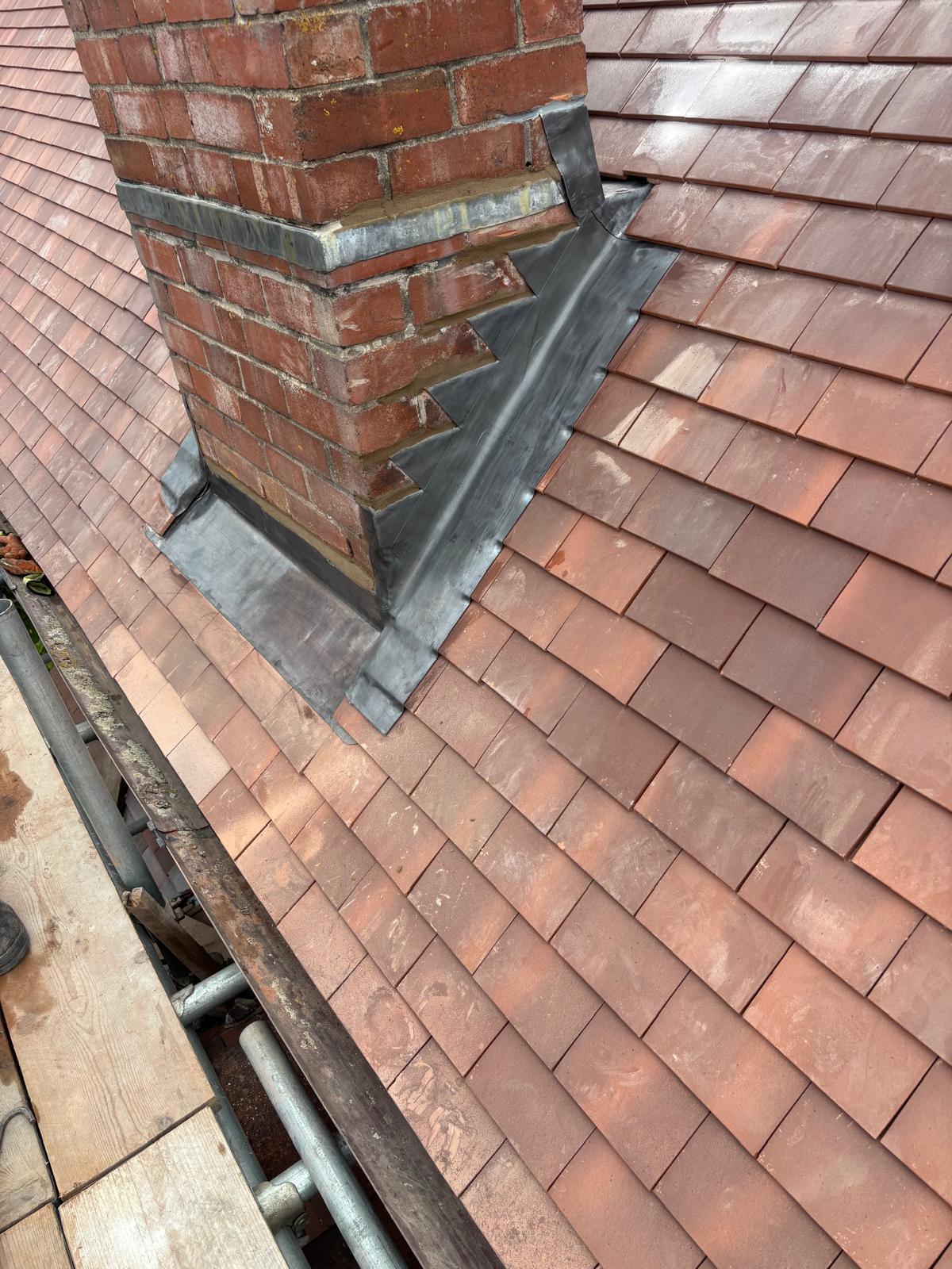 Stepped lead flashing around a chimney stack