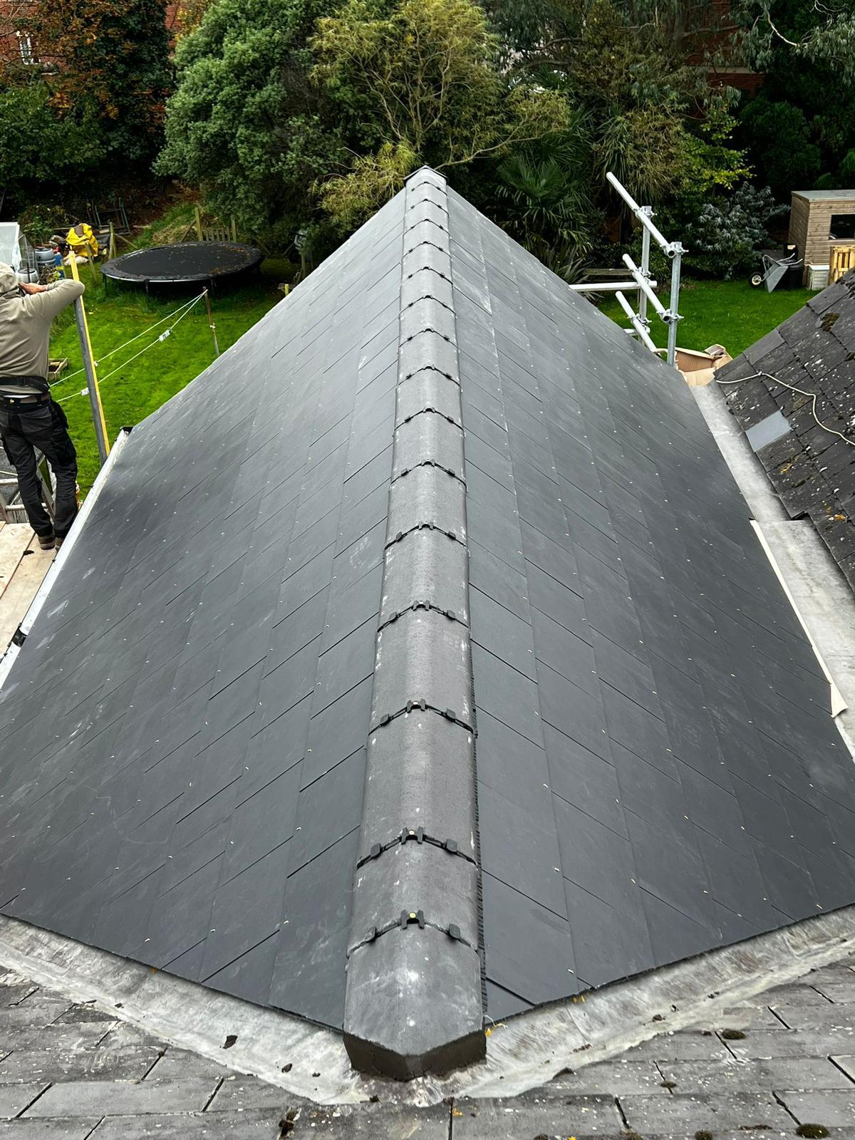 New natural slate hipped roof installation in Surrey