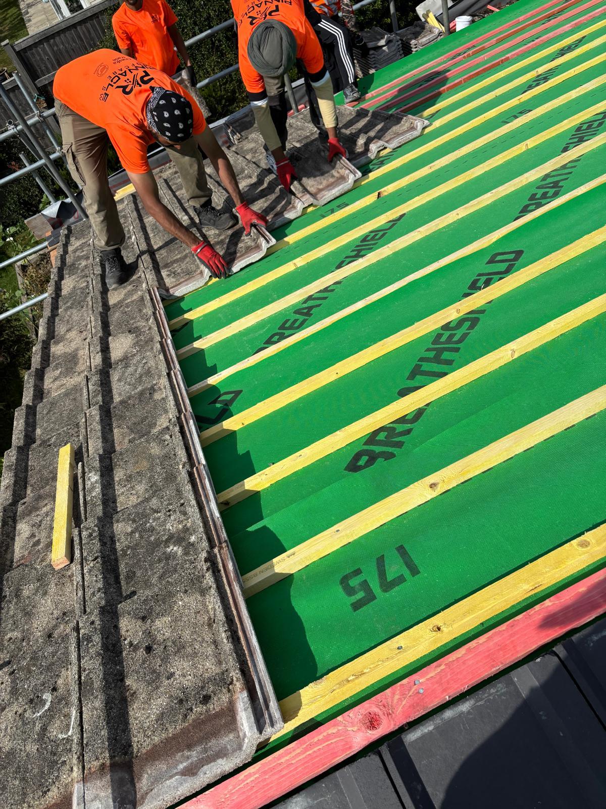 Alpha Roofcare team laying new BreatheShield membrane and battens on a re-roof