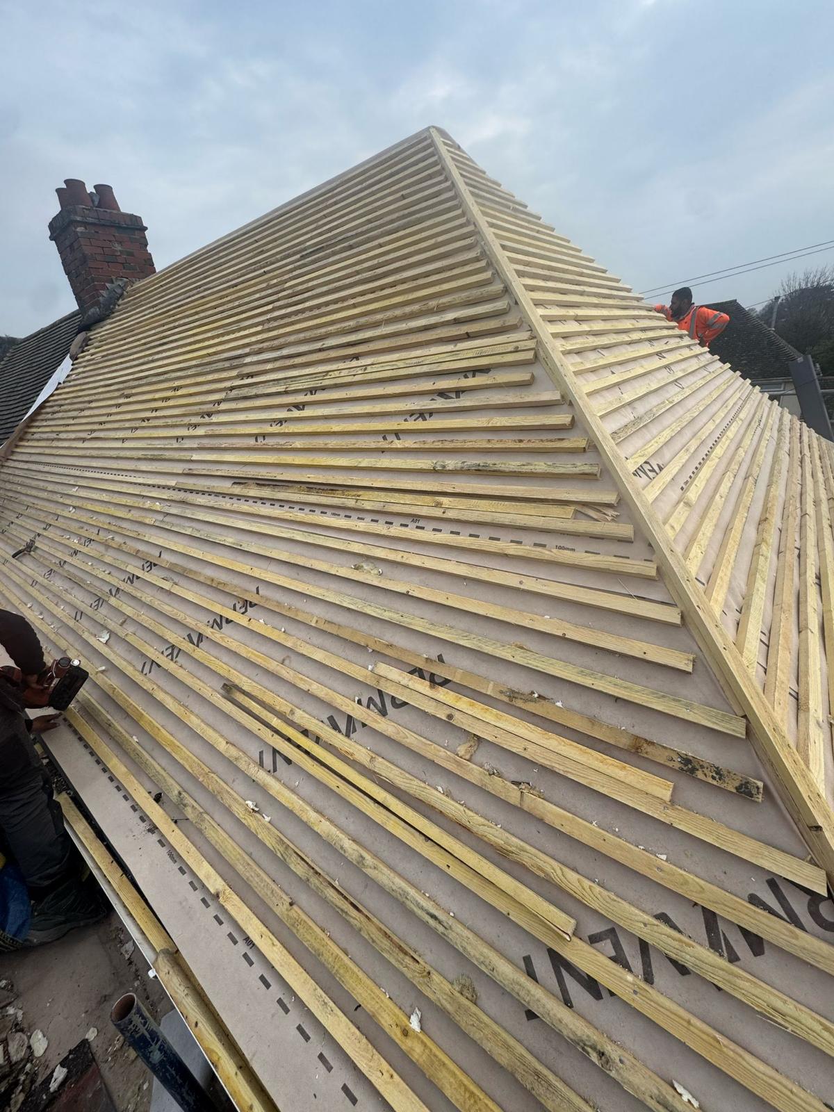 Complete roof strip — new counter-battens and membrane on a hipped roof
